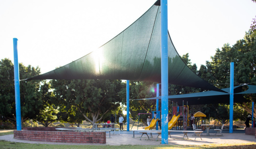 An outdoor playground with quality shade