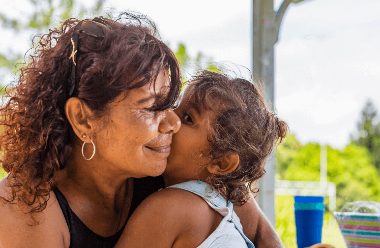 An Aboriginal woman with her granddaughter